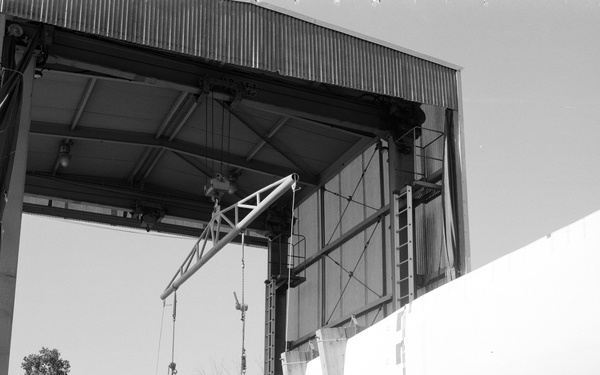 MOD-0 WIND TURBINE BLADE WITH STRAIN GAUGES INSTALLED AND MOD-0 WIND TURBINE TEST STAND