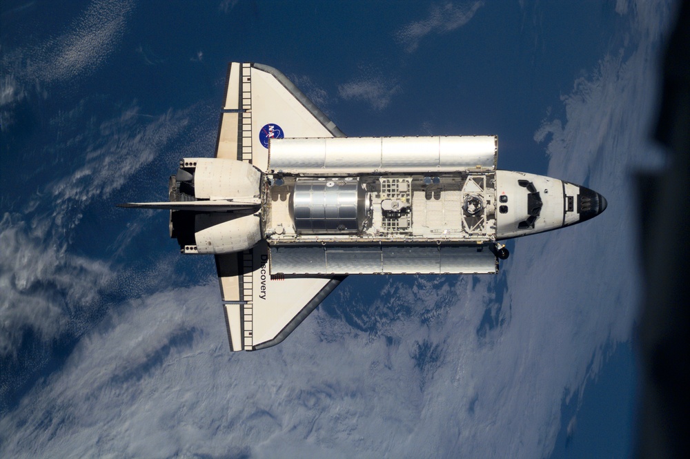 View of Discovery approaching the ISS for docking during the STS-105 mission