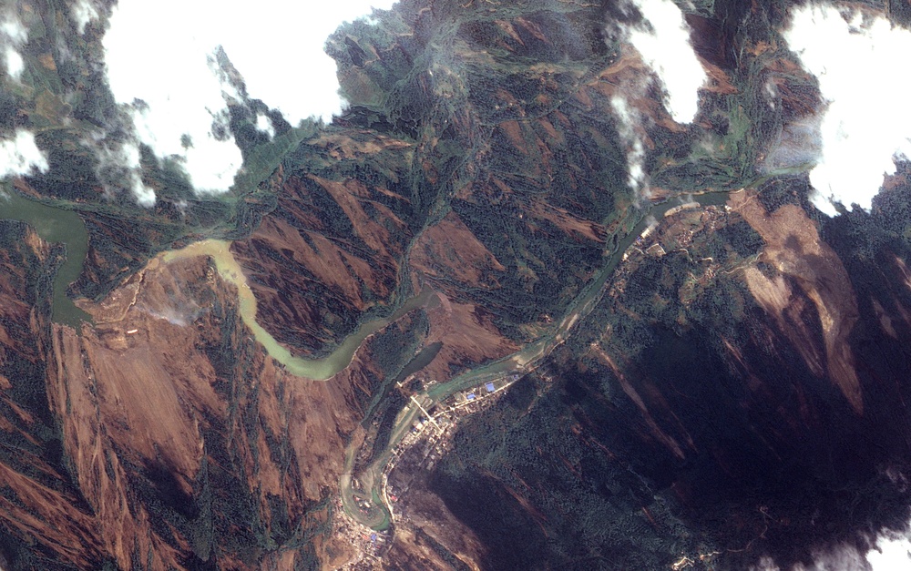 Dam Breach Swells Jianjiang River: Image of the Day