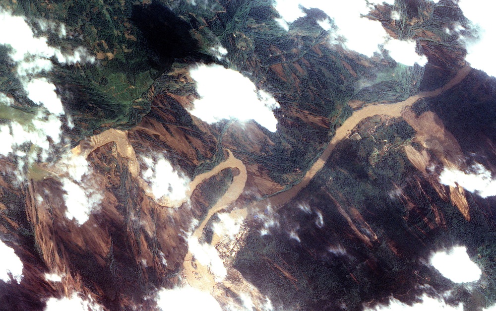 Dam Breach Swells Jianjiang River: Image of the Day