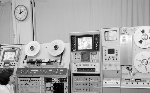 JIM ELY WITH TELEVISION TV TAPE MACHINES AND SCREENS