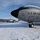 108th Wing removes snow from winter storm Nemo Two U.S. Air Force aircraft are parked on a snow-covered tarmac under a partly cloudy blue sky. The foreground aircraft is clearly marked with 'U.S. AIR FORCE', tail number 3544, and unit designation '108 WG' (108th Wing), consistent with a KC-135 Stratotanker. Snow accumulation on the fuselage and ground indicates recent or ongoing winter weather conditions.