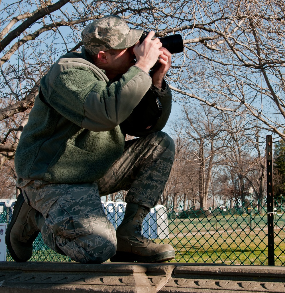 Tech. Sgt. Eric Miller takes photos during the 57th Presidential Inauguration