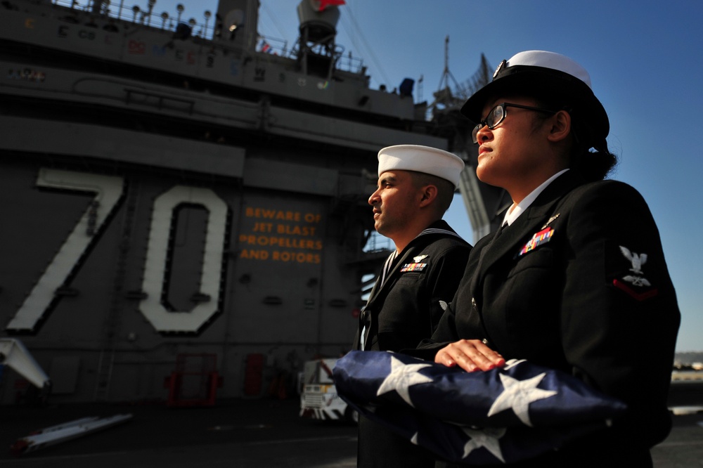 USS Carl Vinson sailors shift the colors