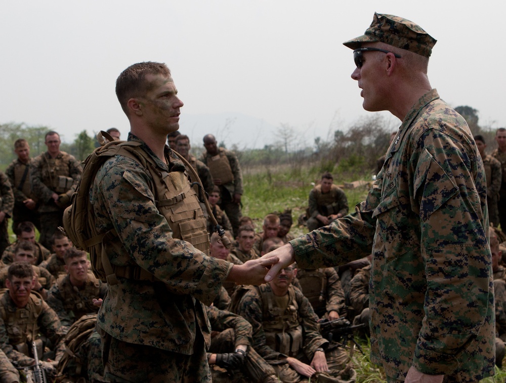 1st MAW CG presents coin to 'Lava Dog'