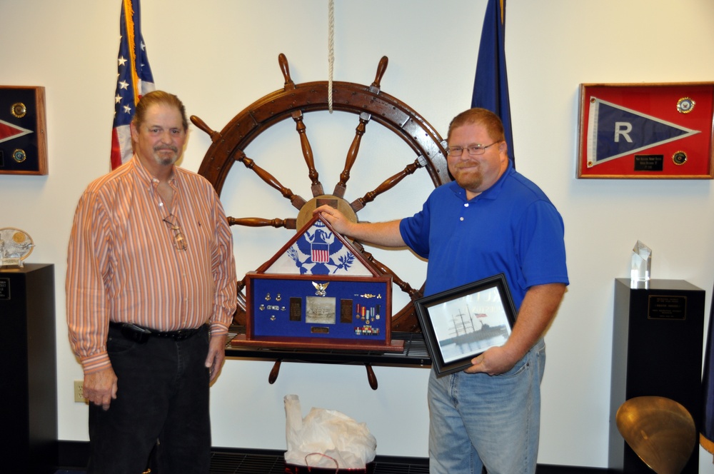 Coast Guardsman reuinted with his shadow box after three years
