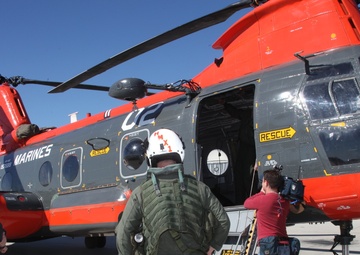Search and rescue service members rappel into forest, save lives