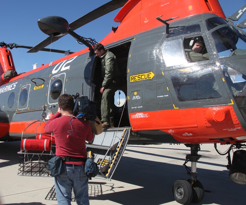 Search and rescue service members rappel into forest, save lives