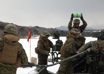 Marines fire howitzers in deep snow, frigid conditions