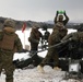 Marines fire howitzers in deep snow, frigid conditions