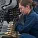 USS Hue City sailors load ammunition