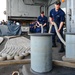 USS Carl Vinson sailors heave mooring lines