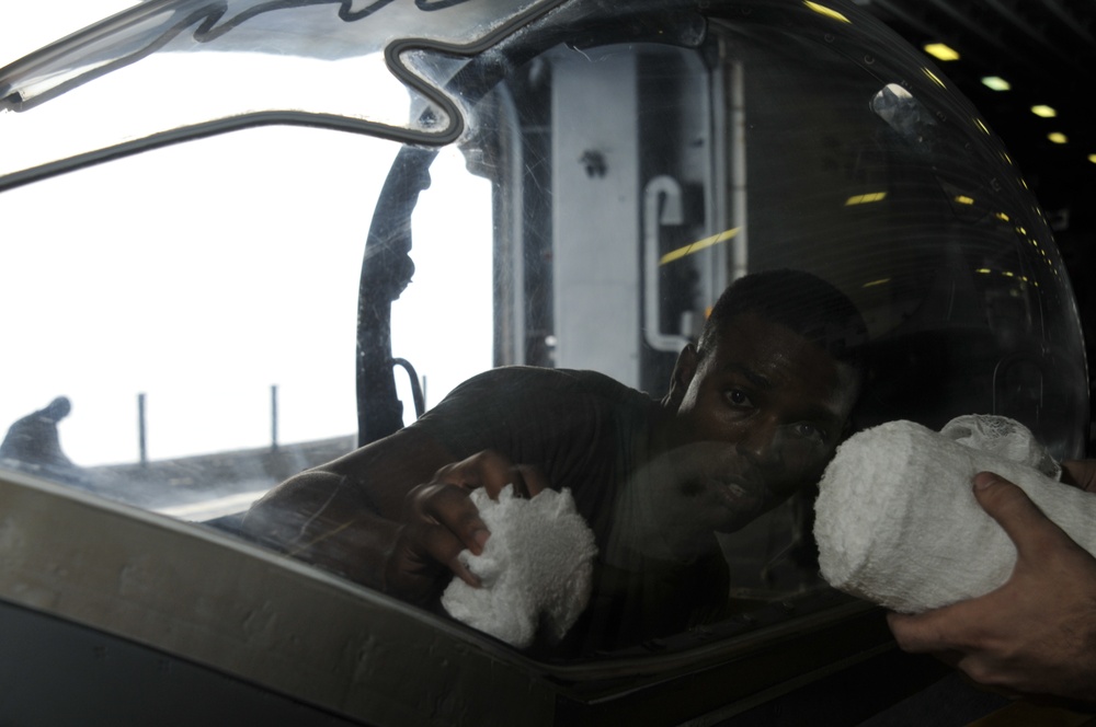 Squadron Marines clear AV-8 canopy