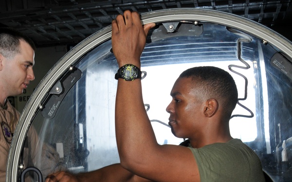 Squadron Marines clear AV-8 canopy