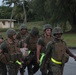 Marines practice stretcher carries during workout