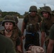 Marines practice stretcher carries during workout