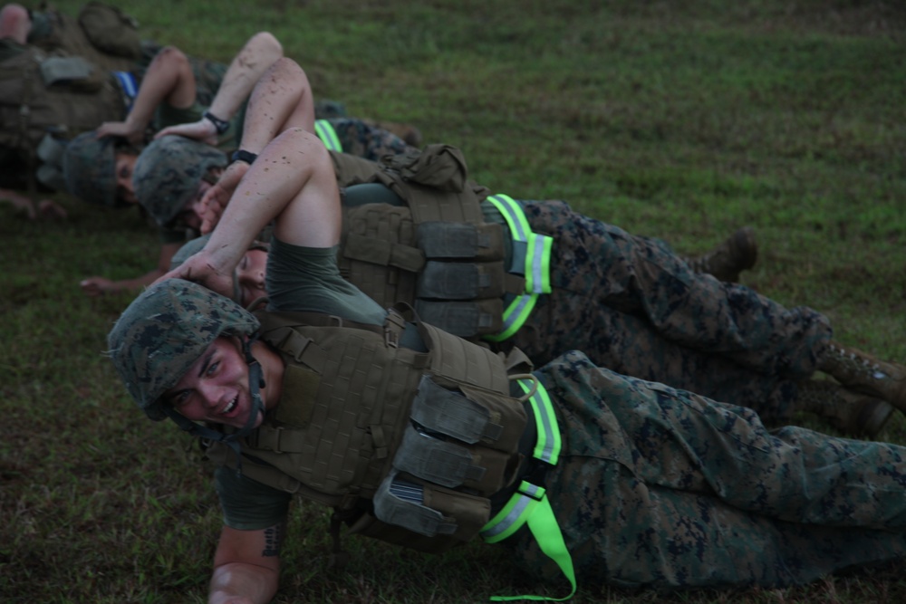 Marines practice stretcher carries during workout