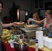 Girl Scouts cook dinner for single Sailors