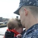 Sailor holds son for first time