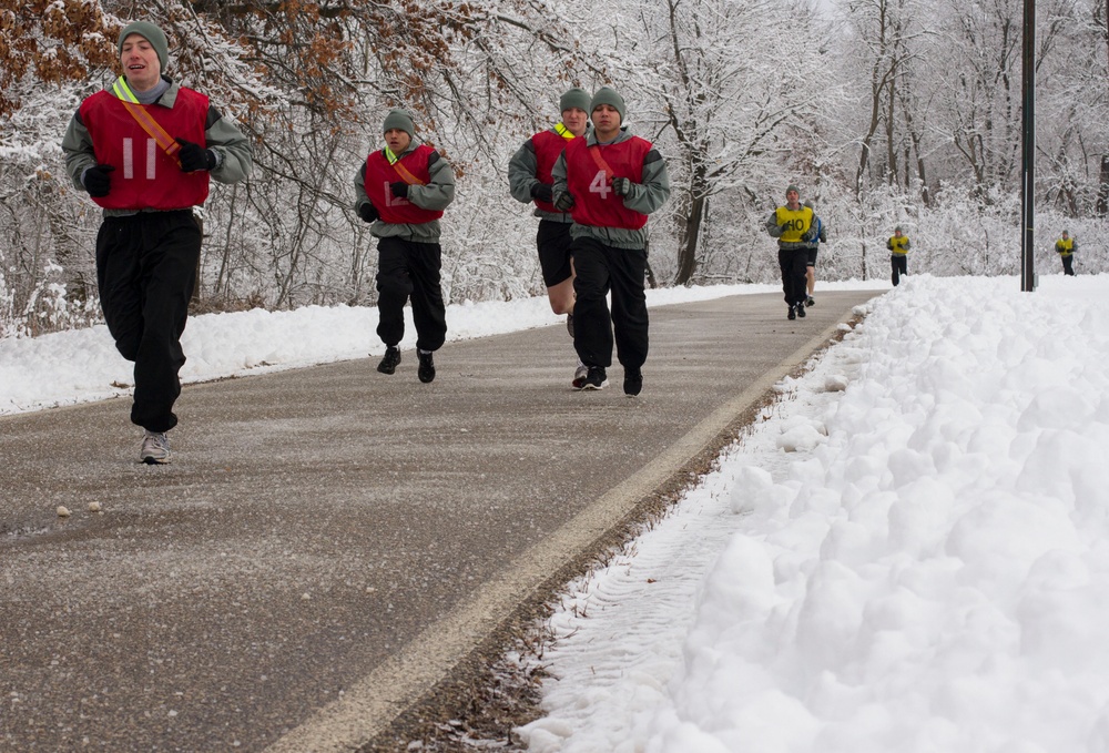 Best Warrior Competitors run two miles in winter conditions