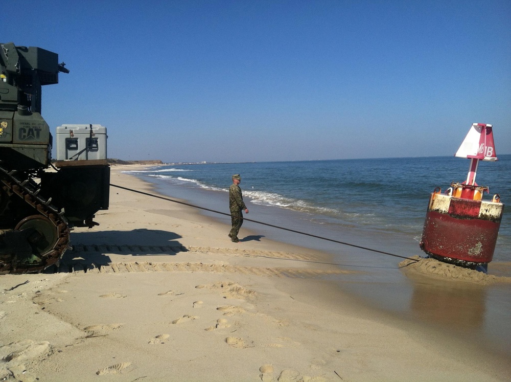 Coast Guard, Navy remove aground buoy