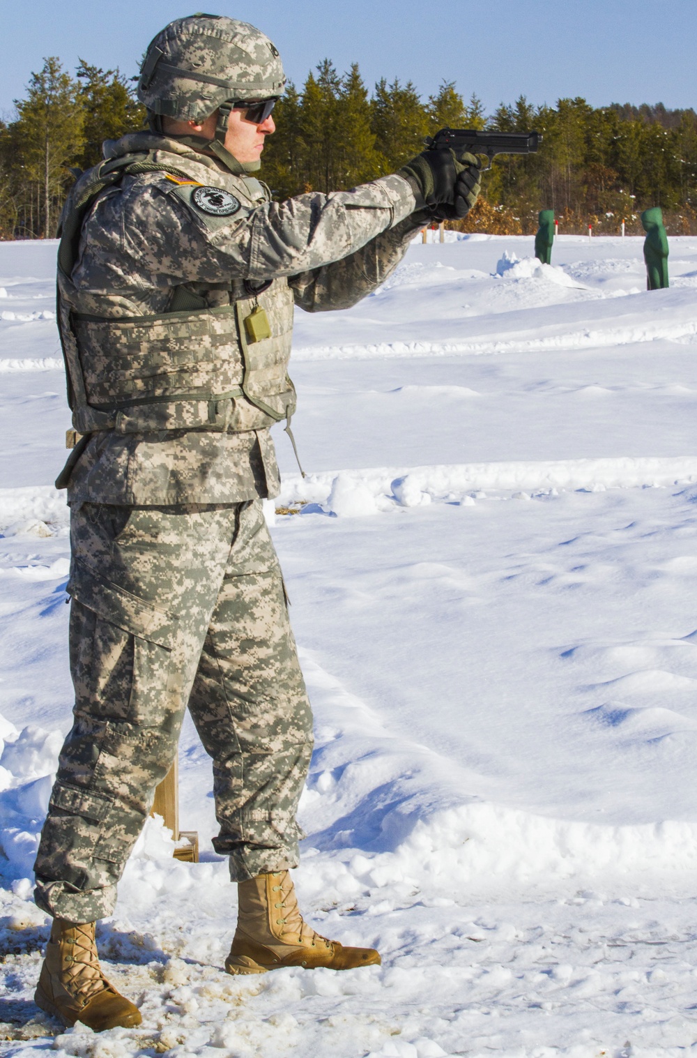 Staff Sgt. Maybury fires off the 9mm at weapons qualification for Best Warrior Competition