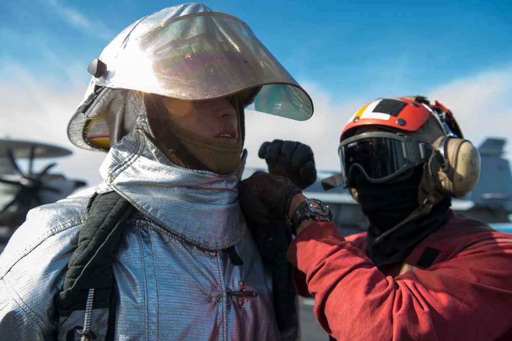 USS Dwight D. Eisenhower sailors drill