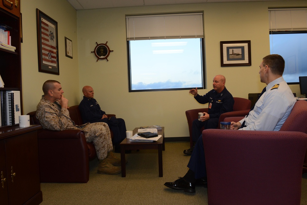 Rear Adm. Taylor briefs Sgt. Maj. Bryan Battaglia