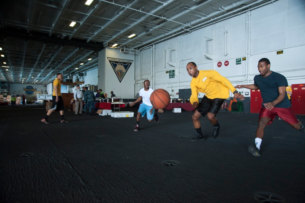 USS Harry S. Truman sailors play basketball