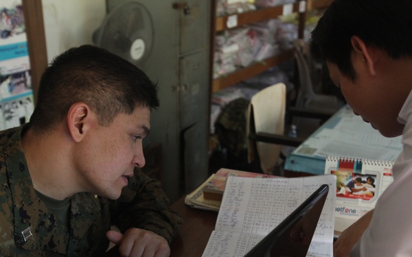 US sailors help organize files during Cambodia MEDEX 13-1