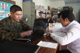 US sailors help organize files during Cambodia MEDEX 13-1