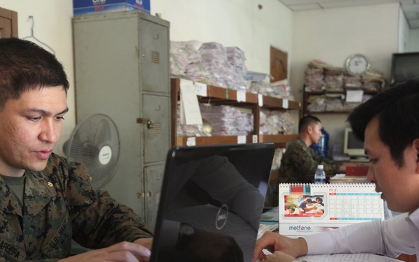 US sailors help organize files during Cambodia MEDEX 13-1