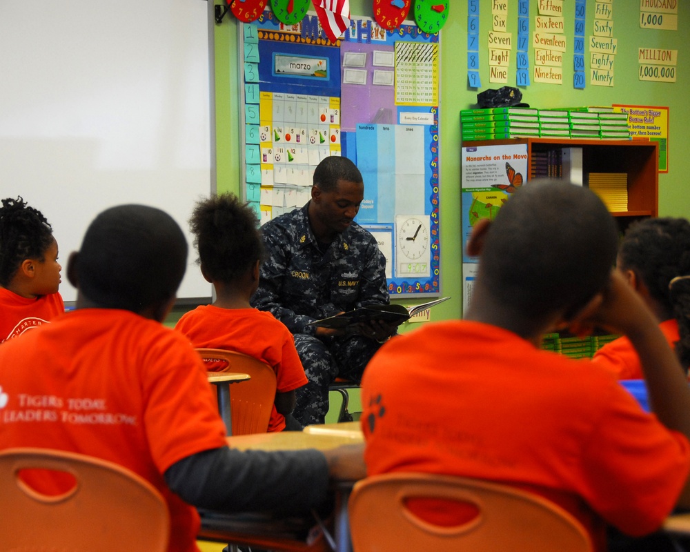 Fighting Tigers read for students at Tiger Academy Elementary