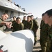 Capt. Sean Roberts, a FA-18/D Hornet pilot with Marine All Weather Fighter Attack Squadron 224, points out different parts of a FA-18/D to members of the Japan Ground Self Defense Force during a recent visit to Marine