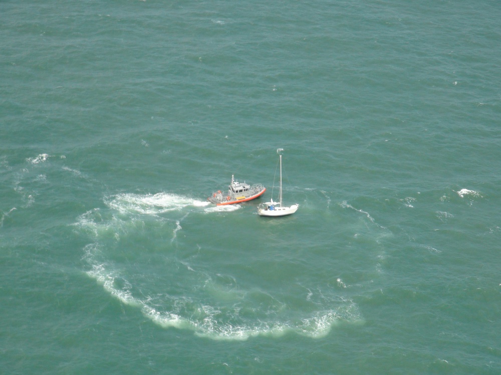 Coast Guard members rescue two sail boaters south of Sabine Pass