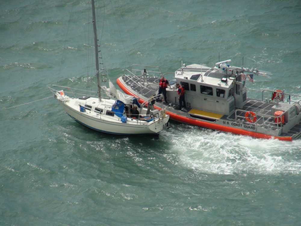 Coast Guard members rescue two sail boaters south of Sabine Pass