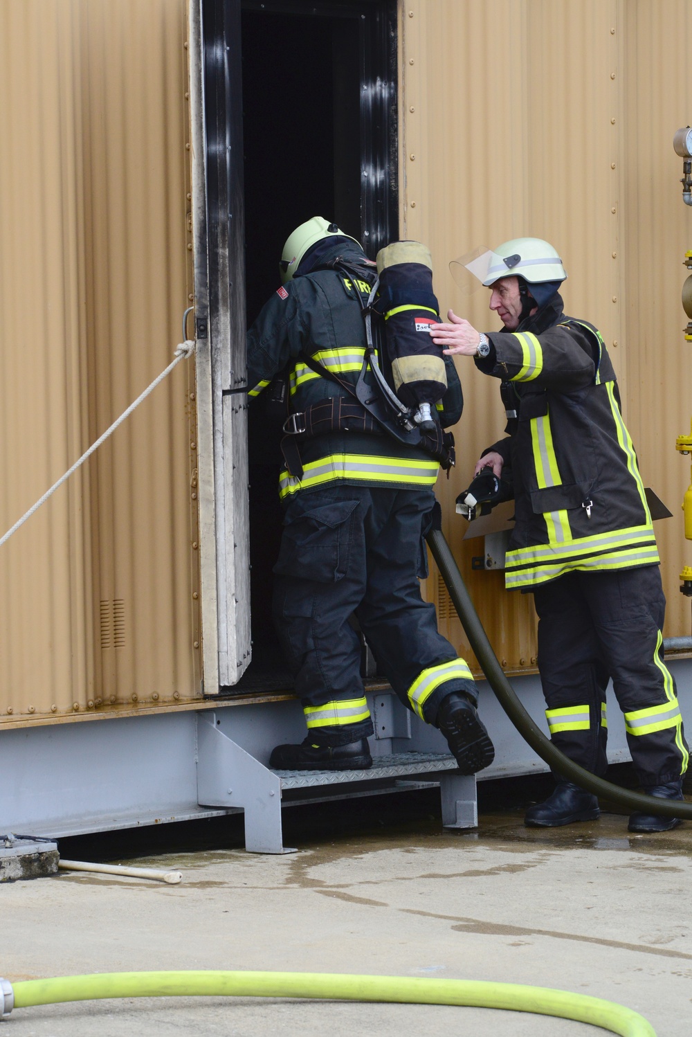 Civilian firefighters from US Army Garrison Ansbach Fire Department train