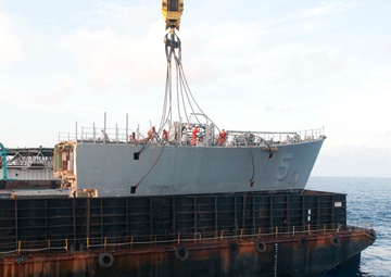 Removing the bow of mine countermeasure ship Ex-Guardian