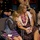 Hawaii State Medal of Honor ceremony pays tribute to fallen service members Two females, likely a mother and daughter, are seated at what appears to be a formal military ceremony. The older woman wears multiple flower leis and a patterned dress, while the younger girl is visibly emotional and wiping tears with a tissue. A uniformed military soldier with a name tag reading 'HANSEN' is visible in the background.