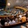 Hawaii State Medal of Honor ceremony pays tribute to fallen service members A large legislative or governmental chamber is filled with attendees for what appears to be a formal session or ceremonial event. The semicircular chamber features tiered public gallery seating packed with observers watching proceedings on the floor below. The architecture includes distinctive decorative wall murals, a spherical chandelier, and wooden curved balcony railings suggesting a Pacific or Hawaiian governmental building.