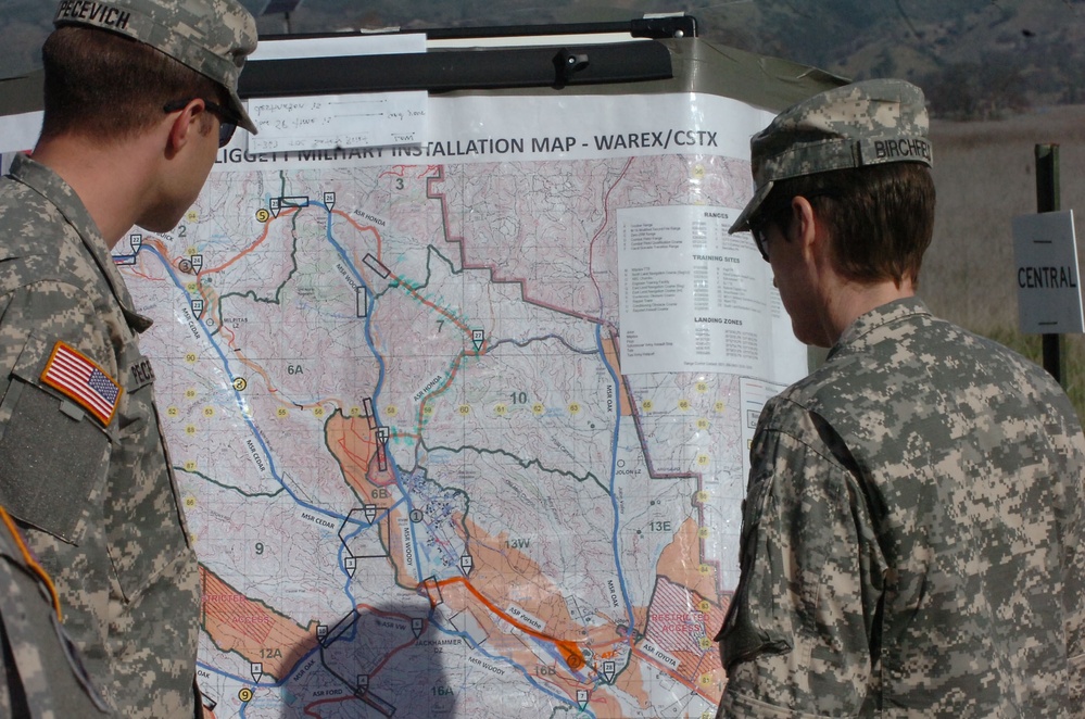 Briefing visitors on training areas during war exercise