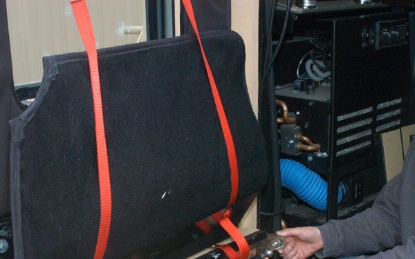 Navy designs mechanized rear-door assist for mine resistant vehicles