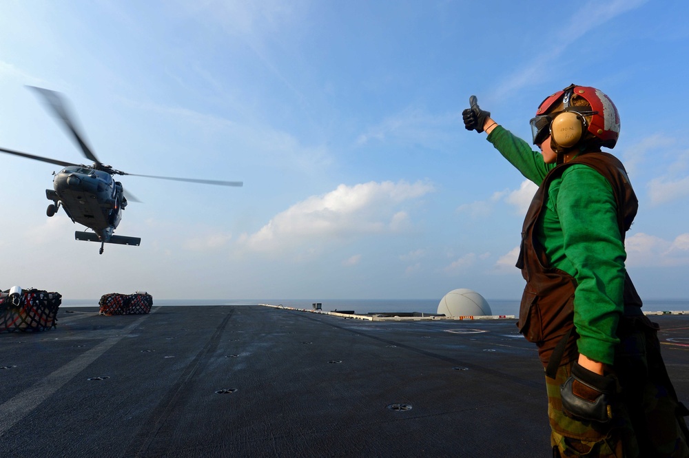 Signaling an MH-60S Sea Hawk