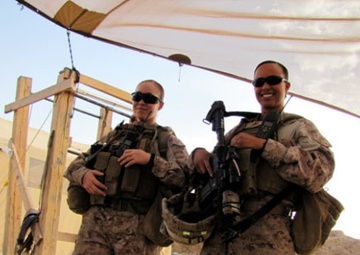 Cpl Brandy Bates (left) and Ensign Iris D. Manso (right) pose for a photo