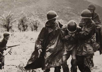 Kapaun carries a soldier