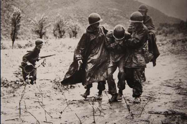 Kapaun carries a soldier