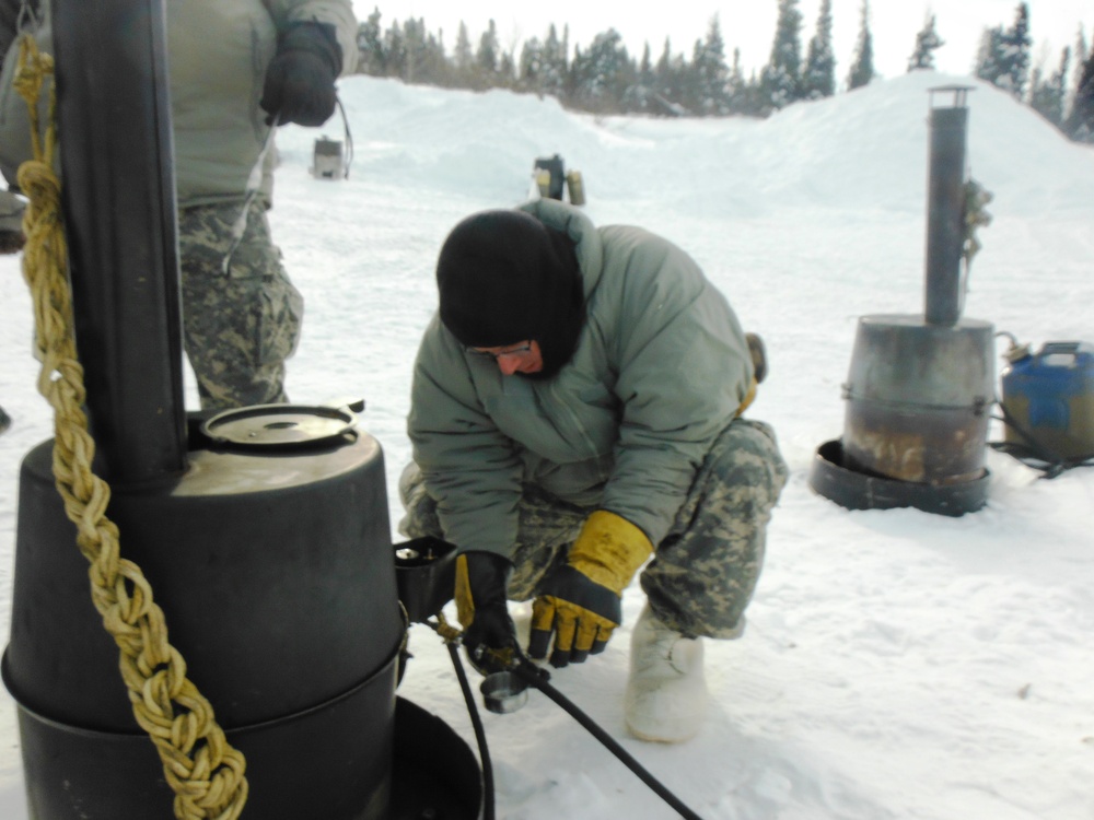 Soldier employing an H-45 space heater