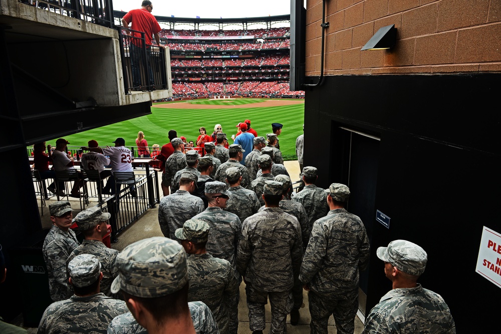 Airmen present giant US flag at Cardinals home opener