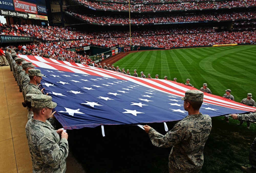 Airmen present giant US flag at Cardinals home opener