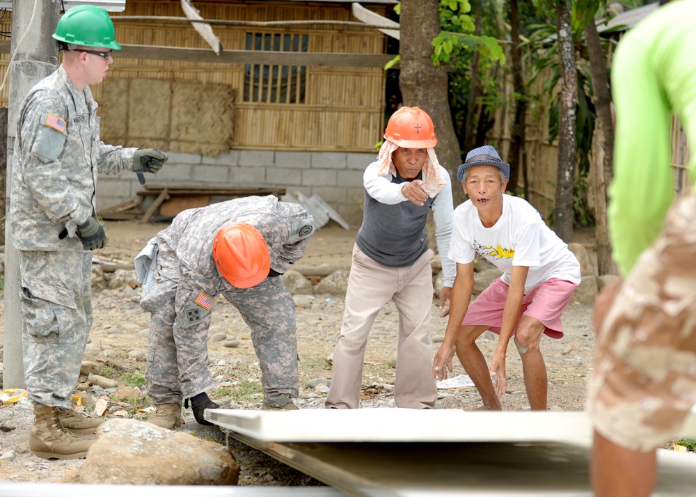 BK 13 - Barangay church volunteers help CJCMOTF team with construction